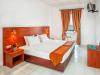 13-Xenios-Dolphin-Beach-Hotel-room